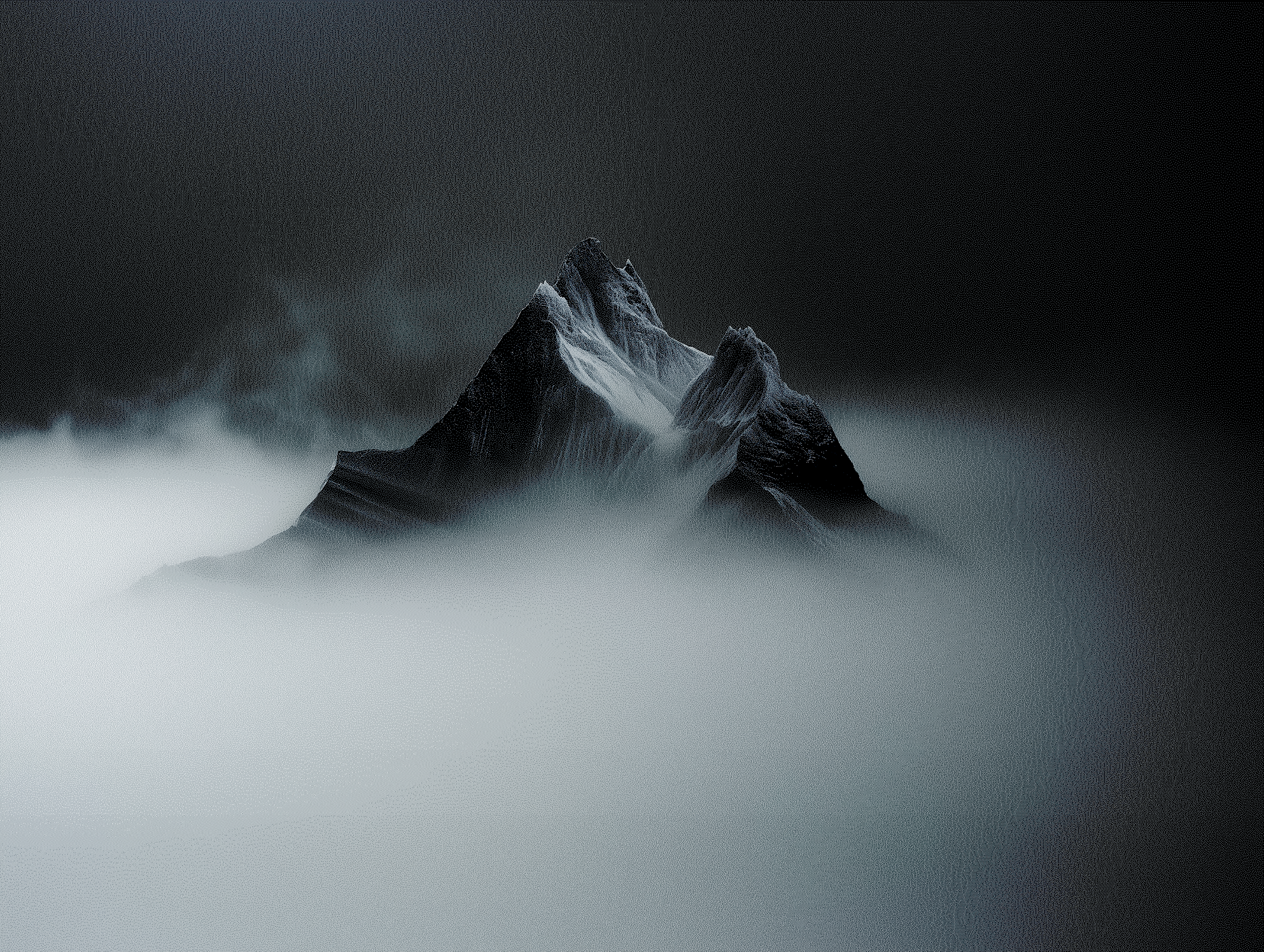 Mountain emerging from fog